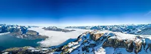 Aerial drone view of snow covered mountains and ski slopes, ski area Stoos, Switzerland