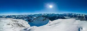 Aerial drone view of snow covered mountains and ski slopes, ski area Stoos, Switzerland