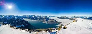 Stoos Prints: Aerial drone view of snow covered mountains and ski slopes, ski area Stoos, Switzerland