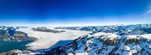 Stoos Prints: Aerial drone view of snow covered mountains and ski slopes, ski area Stoos, Switzerland