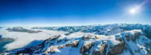 Stoos Prints: Aerial drone view of snow covered mountains and ski slopes, ski area Stoos, Switzerland