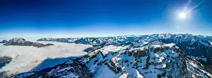 Stoos Prints: Aerial drone view of snow covered mountains and ski slopes, ski area Stoos, Switzerland