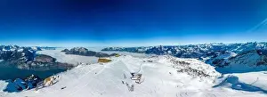 Aerial drone view of snow covered mountains and ski slopes, ski area Stoos, Switzerland