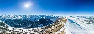 Aerial drone view of snow covered mountains and ski slopes, ski area Stoos, Switzerland