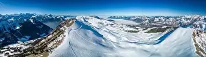 Aerial drone view of snow covered mountains and ski slopes, ski area Stoos, Switzerland