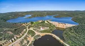 Hydro Prints: Aerial drone view of Valverde Del Camino Silillos Reservoir and Dam is located on the Buitron River within the Tinto