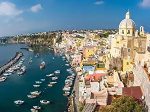 Alleyways Prints: Aerial drone view of vibrantly colorful houses of Marina Corricella in sunny summer weather at Procida island