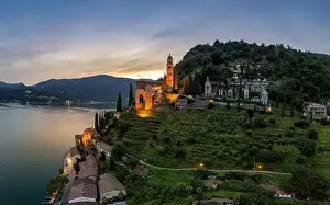 Lugano Prints: Aerial image of the parish church Madonna del Sasso stands on the high hill of Vico Morcote at sunset