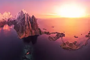 Boat Building Prints: Aerial landscape of calm river and rocky formations located in Hamnoy under sunset sky in evening