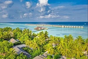 Images Dated 22nd May 2019: Aerial landscape, luxury tropical resort or hotel with water villas and beautiful beach scenery