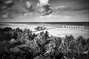 Aerial landscape, luxury tropical resort or hotel with water villas and beautiful beach scenery. Amazing bird eyes view in Maldives landscape seascape
