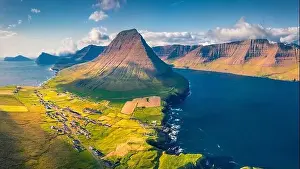 Faroe Island Prints: Aerial landscape photography. Amazing summer view from flying drone of Vidareidi Kirkja