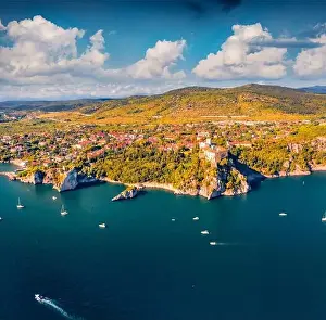 Boat Building Prints: Aerial landscape photography. Colorful summer view from flying drone of Duino Castle