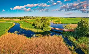 Seret Prints: Aerial landscape photography. View from flying drone small of bridge over Seret river