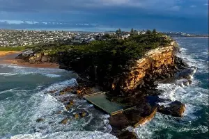 Aerial landscape views of North Curl Curl headland and rock pool iand beach in Sydney's Northern Beaches Ausralia