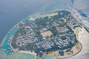 Aerial Maldives island landscape with local island beach and dock on atoll island