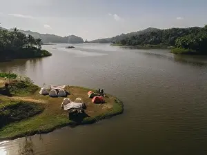 Forest Green Prints: Aerial morning view of camping ground area by the Sermo Lake with forest hill on the background in Kulonprogo