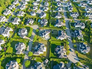 Aerial of new construction luxury residential neighborhood street single family homes real estate