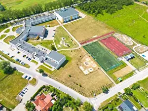 Aerial of new construction luxury residential neighborhood street single family homes real estate
