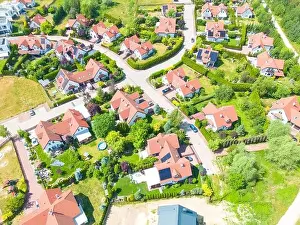 Aerial of new construction luxury residential neighborhood street single family homes real estate