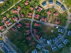 Aerial of new construction luxury residential neighborhood street single family homes real estate