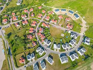 Aerial of new construction luxury residential neighborhood street single family homes real estate