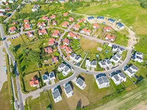 Aerial of new construction luxury residential neighborhood street single family homes real estate