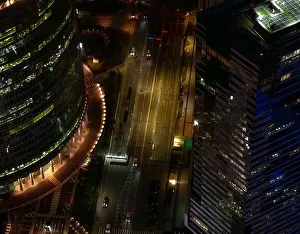 Business District Prints: Aerial night view of illuminated street between skyscrapers in Moscow City