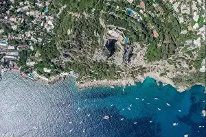 Gods View Prints: Aerial overhead drone shot of Aerial overhead drone shot of mountain top villa with pool above big mountain hole cave