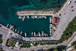 Cephalonia Prints: Aerial overhead drone shot of boats at Poros Harbour on Kefalonia Island in Greece
