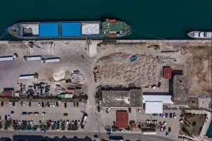 Cephalonia Prints: Aerial overhead drone shot of cargo ship in Argostolion town harbour on Kefalonia Island