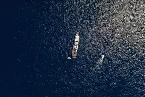 Faraglioni Prints: Aerial overhead drone shot of luxury yacht in Tyrrhenian sea near Capri Island in summer