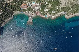 Noon Prints: Aerial overhead drone shot of southern Capri Island coastline with yachts in summer noon