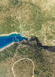 Covert Prints: Aerial overhead drone shot of Stiniva covert cove beach in Adriatic sea on Vis Island in Croatia in summer
