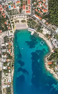 Dalmatian Coast Prints: Aerial overhead drone shot of sunset beach in Dubrovnik by Dalmatia coastline in Croatia summer