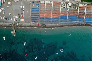 Amalfi Prints: Aerial overhead drone shot view of Positano beach with beach umbrella in morning time