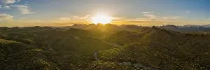 Aerial Panorama Prints: Aerial panorama over the Arizona desert during sunset with mountains and a meandering dry stream