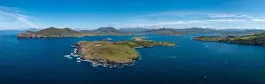 An aerial panorama of the coastal landscape of the Iveragh Peninsula with Beginish and Valentia Island