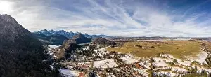 Aerial panorama drone shot of Alpine mountain range near Neuschwanstein castle in Germany winter
