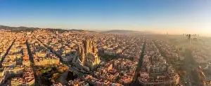Agbar Tower Prints: Aerial panorama drone shot of Barcelona center and coast in foggy morning golden hour in Spain winter