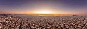 Before Sunrise Prints: Aerial panorama drone shot of Barcelona with sunrise over sea horizon in Spain winter dawn