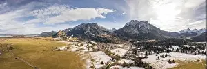 Fussen Prints: Aerial panorama drone shot of picturesque Neuschwanstein Castle on snowy hill in winter sunlight in Germany