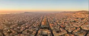 Agbar Tower Prints: Aerial panorama drone shot of sunrise over sea horizon of Barcelona city in Spain winter dawn