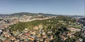 Radio Tower Prints: Aerial panorama drones shot of park on hill outside Barcelona city in Spain winter morning