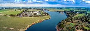 Holiday Park Prints: Aerial panorama of Hopkins River and holiday park surrounded by grasslands