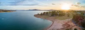 Aerial panorama of scenic lake and hills in Australia at sunset