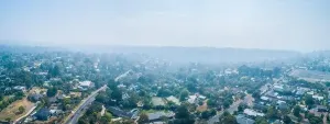 Bushfire Prints: Aerial panorama of urban areas of Melbourne covered in smoke from bush fires