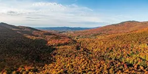 Vermont Prints: Aerial panorama of the valley with Smugglers Notch vacation and skiing resort in the fall