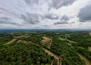 Aerial Panorama between Vaugines and Cucuron: Cloudy Skies Over Ancient and New Forests in PACA