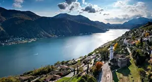 Lago Di Lugano Prints: An aerial panorama view of Vico Morcote village and Lake Lugano in southern Switzerland